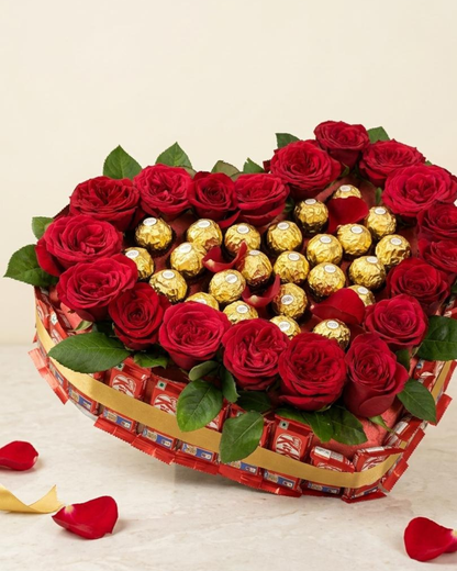Heart-shaped red roses and gold Ferrero Rocher chocolate